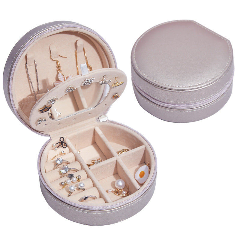 Runde Schmuckschatulle aus Leder, tragbar, ideal für Reisen und zur Aufbewahrung von Schmuck.